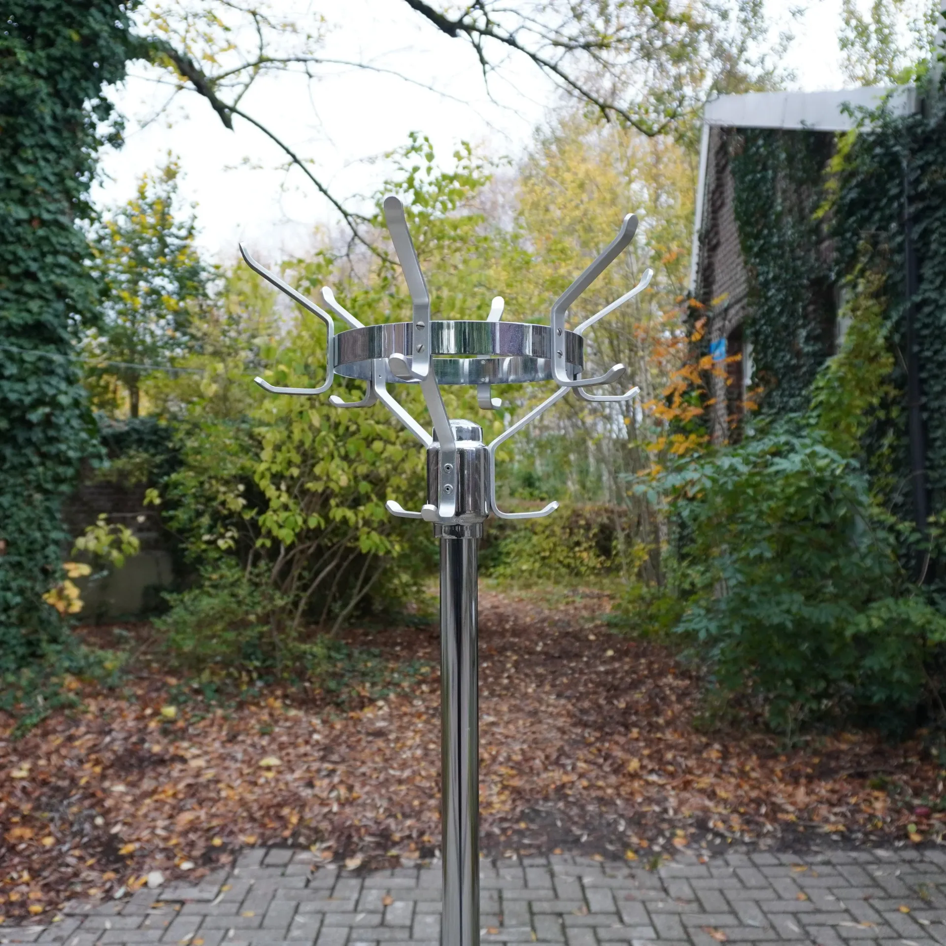 Coat rack in chromed steel with cast iron base